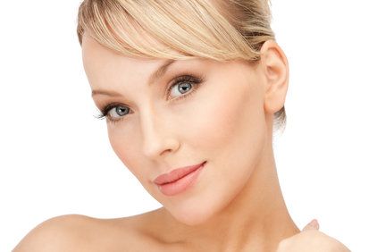 close-up of a woman's face, including her ears